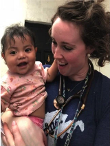 baby held by doctor