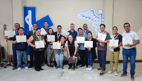 Group of people holding plaques
